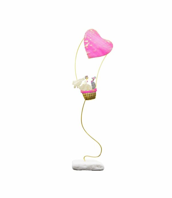 Androgynous in a heart-balloon eartshop