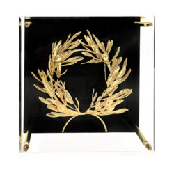 Golden olive wreath on black plexiglass