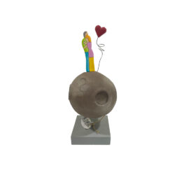 Couple on brown planet with heart on base